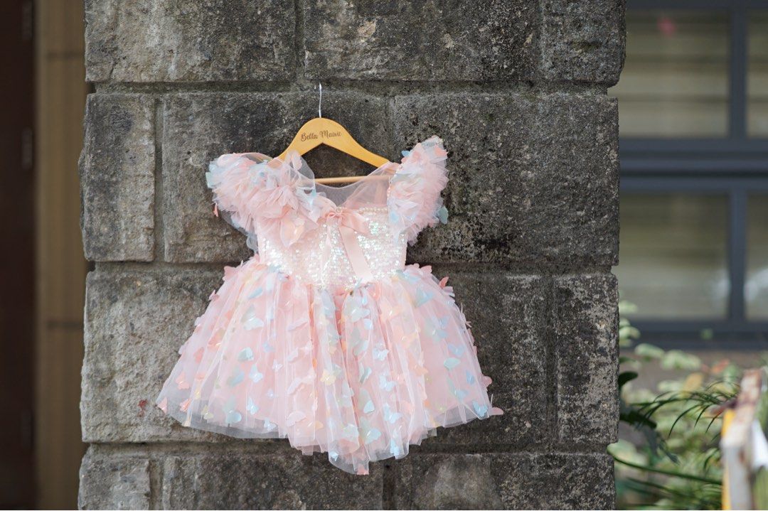 Pink Butterfly Dress (Category: Babies & Kids Fashion) located in Pasig City. Submitted by declutteredstudio.mnl (Listing ID 1425582318, Image 2). Description: Perfect for first birthday with butterfly wings detail at the back.