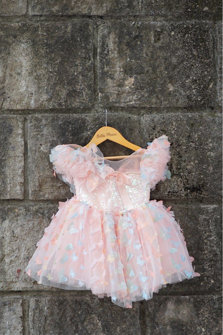 Pink Butterfly Dress (Category: Babies & Kids Fashion) located in Pasig City. Submitted by declutteredstudio.mnl (Listing ID 1425582318, Image 1). Description: Perfect for first birthday with butterfly wings detail at the back.