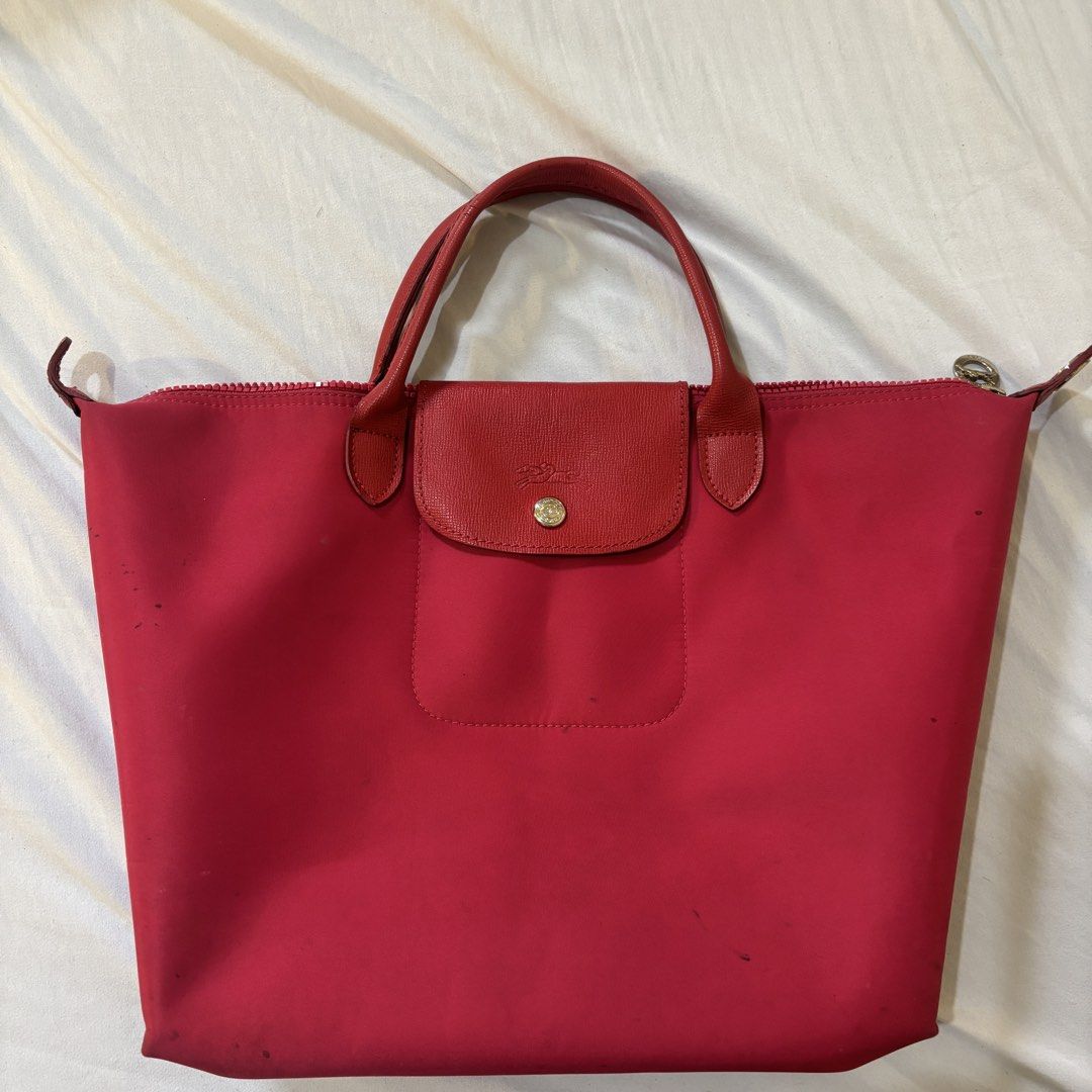 Pink Longchamp Le Pliage Tote Bag (Category: Luxury Bags & Wallets) located in Quezon City. Submitted by ana.declutters (Listing ID 1425453446, Image 1). Description: Well used, with a stains and without the left silver hook. please see photos, feel free to message if you have any questions.