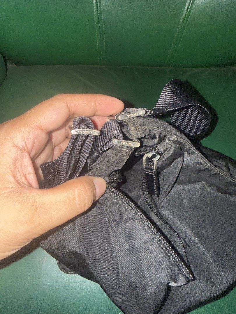 Prada Black Messenger Bag (Category: Luxury Bags & Wallets) located in Cavite. Submitted by okaypreloved (Listing ID 1425546032, Image 3). Description: SIGNS OF USAGE INSIDE BROWNING ALREADY (NOT STICKY) -inside browning is normal sign of wear as to a vachetta leather browning in lv bags -inside stitchings may have some torn open at the seams TARNISHED/CHIPPED HARDWARES 11.5” x 10” ready to use japan seller bought 12000 still presentable *prefer 