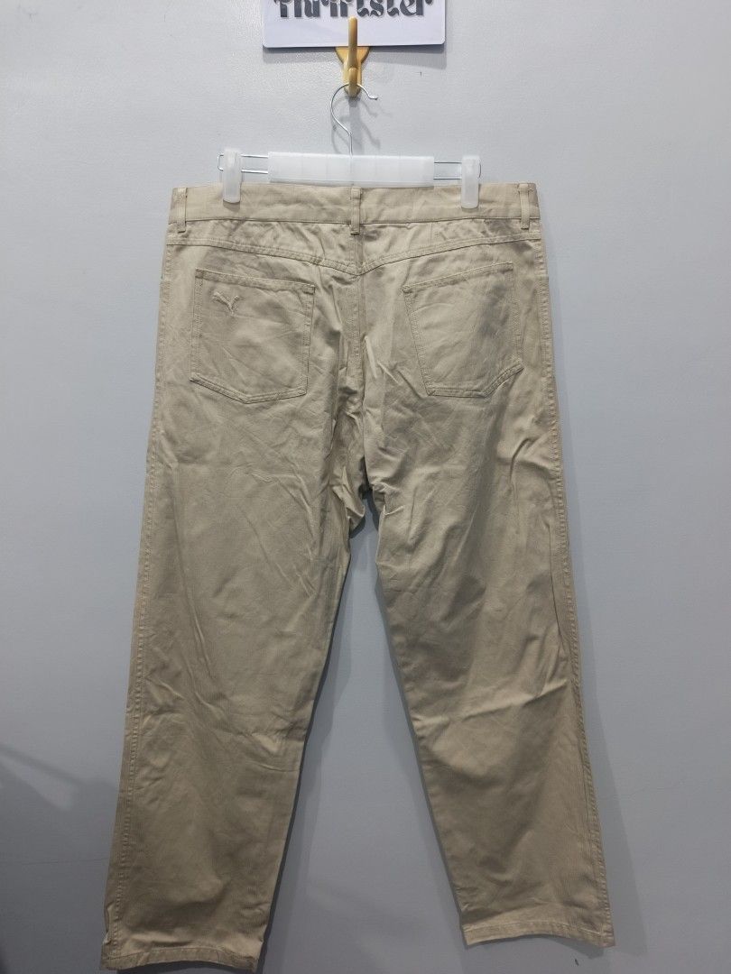 Puma Khaki Pants (Category: Chinos) located in Leyte. Submitted by chaem89 (Listing ID 1425579625, Image 2). Description: Khaki pants from Puma. Features a button closure and two front pockets. The pants have a straight leg cut. Made in China. Good as new Cond sz L on tag 34x38.