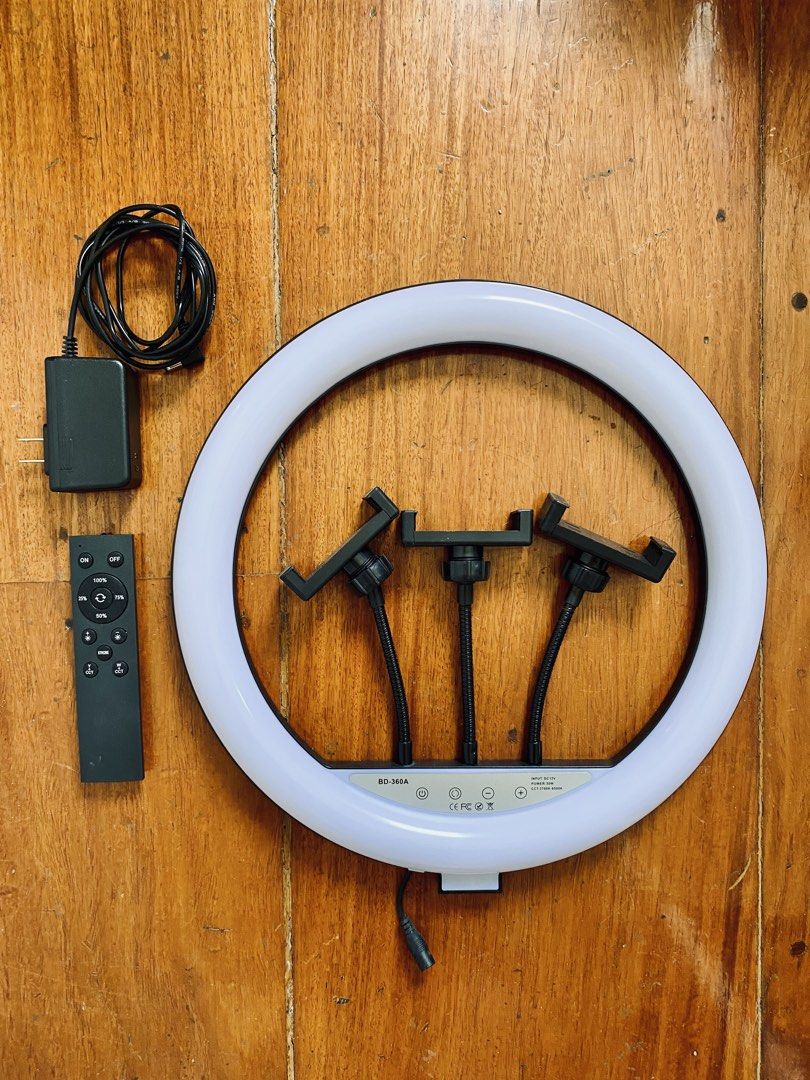 Ring Light with Remote and Tripod BD-360 14” (Category: Lighting & Studio Equipment) located in Paranaque City. Submitted by roccstar (Listing ID 1425481173, Image 2). Description: - BD-360 14" Ring Light - Includes Remote Control - Comes with Tripod, can support ring light up to 6 feet high - Adjustable Color Temperature with 3 light shades and various levels of brightness - 3 phone holders - Perfect for photos and videos - Easy to set up Item i