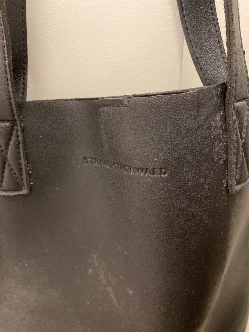 Landscape Straightforward Black Tote Bag (Category: Tote Bags) located in Mandaluyong City. Submitted by weakassbitch (Listing ID 1425562350, Image 2). Description: RUSH SALE!!! - 7/10 condition - Rectangular shape with long handles - Interior has a small pocket and a snap closure.