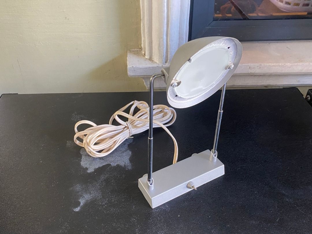 Vintage IKEA MAGIKER Desk Lamp (Category: Lighting) located in Santa Rosa. Submitted by steezyeezy (Listing ID 1425536404, Image 1). Description: IKEA MAGIKER desk lamp features a sleek, silver design. It has a 12V MAX 70W bulb and a convenient on/off switch. The lamp includes a power adapter and a long cord. It's perfect for providing focused light on your desk or workspace. The lamp is in good working condition..