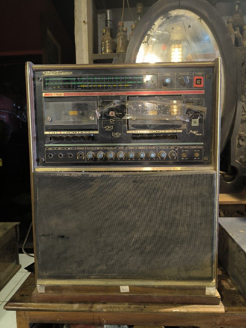 Vintage Magnavox Stereo System (Category: Soundbars, Speakers & Amplifiers) located in Manila. Submitted by makkieenri69972 (Listing ID 1425481767, Image 1). Description: Vintage Magnavox stereo system with radio and dual cassette players. Features a built-in speaker system. Includes various knobs and controls for audio adjustment. The unit has a wooden cabinet and a gold-colored trim..