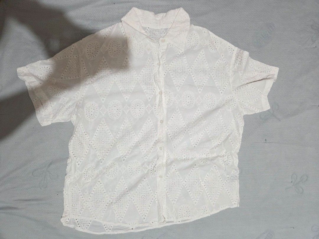 White Eyelet Top (Category: Sleeveless) located in Manila. Submitted by declutterwtly (Listing ID 1425480203, Image 2). Description: Kindly DM me your offers, TYSM 💌 -White eyelet top with button-down closure. -Short sleeves -Detailed geometric pattern. -It has a classic collar and a slightly tailored fit. -The eyelet design adds a touch of elegance and breathability..
