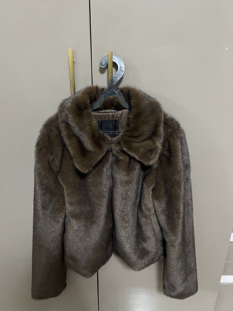 Zara Faux Fur Jacket (Category: Coats, Jackets and Outerwear) located in Manila. Submitted by cluttercrushers (Listing ID 1425452557, Image 3). Description: Brown faux fur jacket from Zara. Features a collared neckline and a cropped length. The jacket has long sleeves and a soft, textured appearance. The jacket is designed with a classic silhouette, suitable for various occasions..