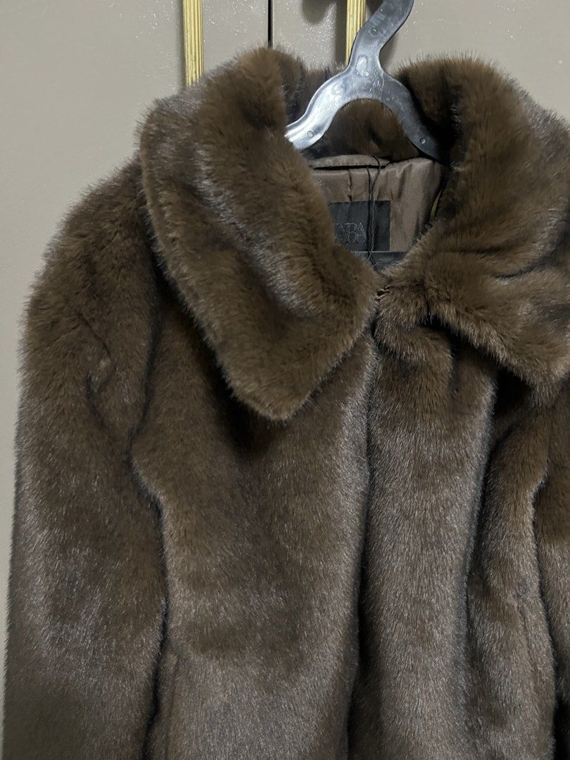 Zara Faux Fur Jacket (Category: Coats, Jackets and Outerwear) located in Manila. Submitted by cluttercrushers (Listing ID 1425452557, Image 2). Description: Brown faux fur jacket from Zara. Features a collared neckline and a cropped length. The jacket has long sleeves and a soft, textured appearance. The jacket is designed with a classic silhouette, suitable for various occasions..