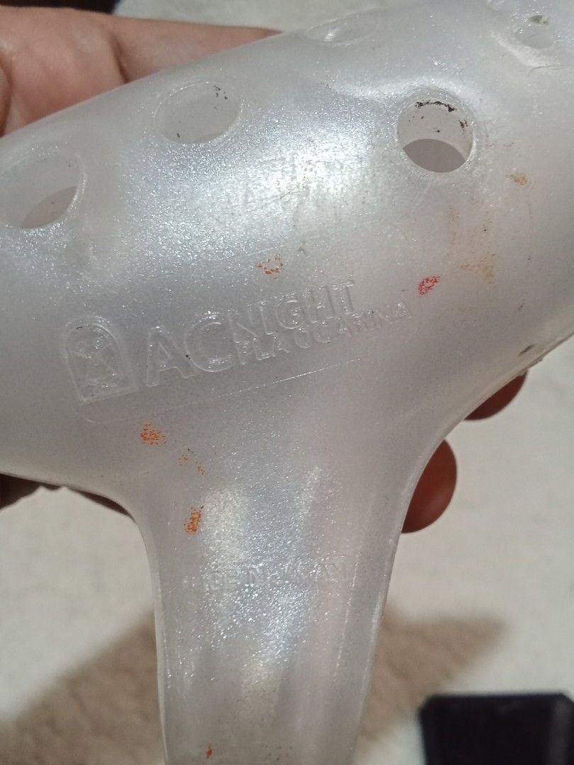 ACNIGHT Ocarina (Category: Musical Instruments) located in Bocaue. Submitted by marajapansurplus (Listing ID 1429561073, Image 2). Description: ACNIGHT ocarina. It has a pearlescent white finish. The ocarina has multiple finger holes. The mouthpiece is located on the bottom right. The brand name is visible on the body of the instrument..