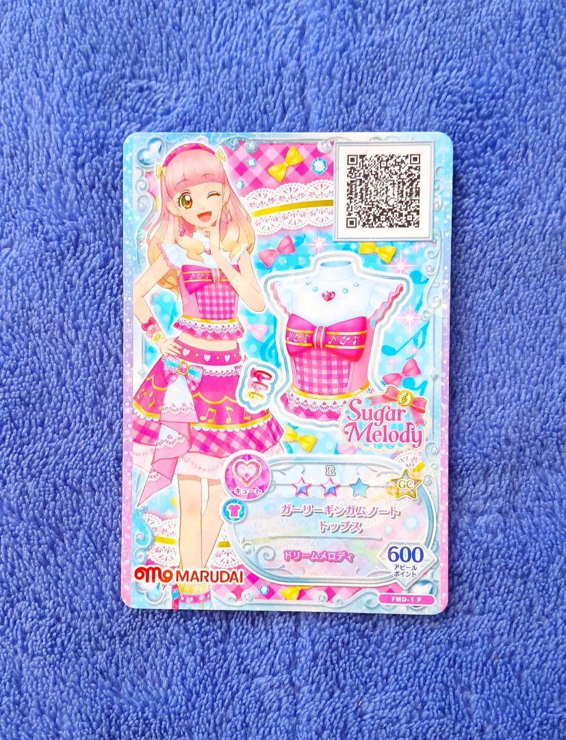 Aikatsu Sugar Melody Girly Gingham Note Top (Category: Raw Singles) located in Iloilo. Submitted by jrmagallanes78 (Listing ID 1429646518, Image 1). Description: PhP 25 per anime card. Card is UNSEALED and item condition is only GOOD with various dents and scuffs ob the surface. Dimensions: approx 58mm x 85mm Material: paper Card condition grading: EXC (EXCEPTIONAL) - unsealed and placed directly to sleeve and/or binder EX (EXCELLENT) - unsealed,