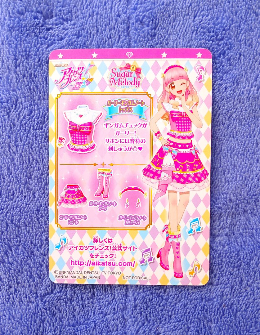 Aikatsu Sugar Melody Girly Gingham Note Top (Category: Raw Singles) located in Iloilo. Submitted by jrmagallanes78 (Listing ID 1429646518, Image 2). Description: PhP 25 per anime card. Card is UNSEALED and item condition is only GOOD with various dents and scuffs ob the surface. Dimensions: approx 58mm x 85mm Material: paper Card condition grading: EXC (EXCEPTIONAL) - unsealed and placed directly to sleeve and/or binder EX (EXCELLENT) - unsealed,