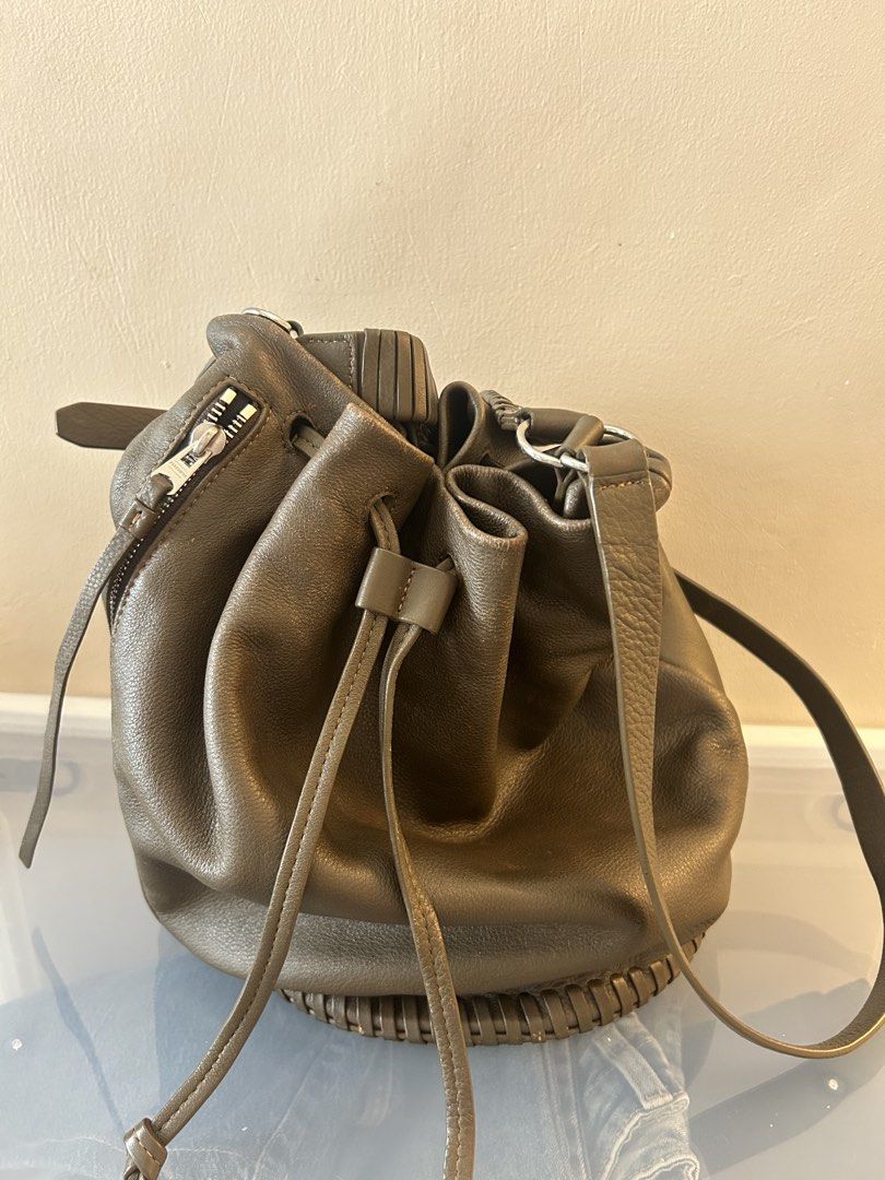 Allsaints Lambskin Bucket Bag (Category: Cross-body Bags) located in Mandaluyong City. Submitted by geri3373 (Listing ID 1429507976, Image 1). Description: Color: Brown with gray undertone No issue.