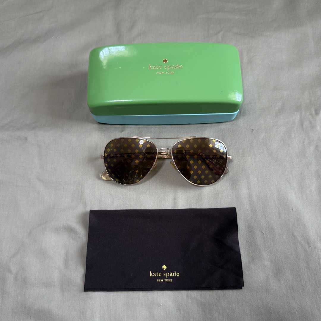 Authentic Kate Spade Aviator Sunglasses (Category: Sunglasses & Eyewear) located in Paranaque City. Submitted by _mrs.j (Listing ID 1429570050, Image 2). Description: Elevate your style with these Kate Spade Avaline2 94R aviator sunglasses in a stunning gold finish. These women’s sunglasses offer a classic pilot shape with a modern twist, perfect for adding a touch of luxury to any look. Featuring UV protective lenses, these Kate Spade sunglasses