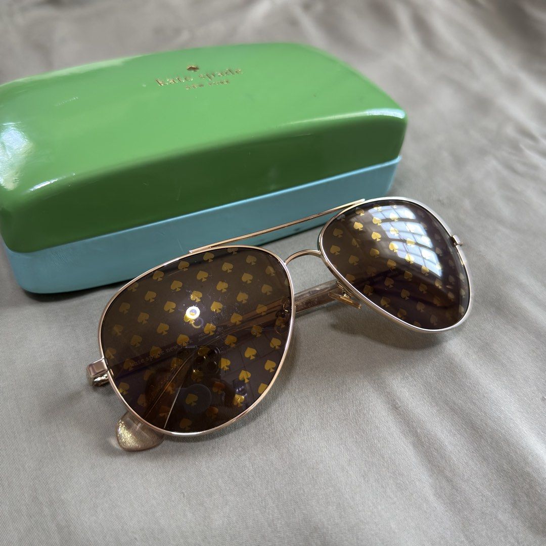 Authentic Kate Spade Aviator Sunglasses (Category: Sunglasses & Eyewear) located in Paranaque City. Submitted by _mrs.j (Listing ID 1429570050, Image 3). Description: Elevate your style with these Kate Spade Avaline2 94R aviator sunglasses in a stunning gold finish. These women’s sunglasses offer a classic pilot shape with a modern twist, perfect for adding a touch of luxury to any look. Featuring UV protective lenses, these Kate Spade sunglasses