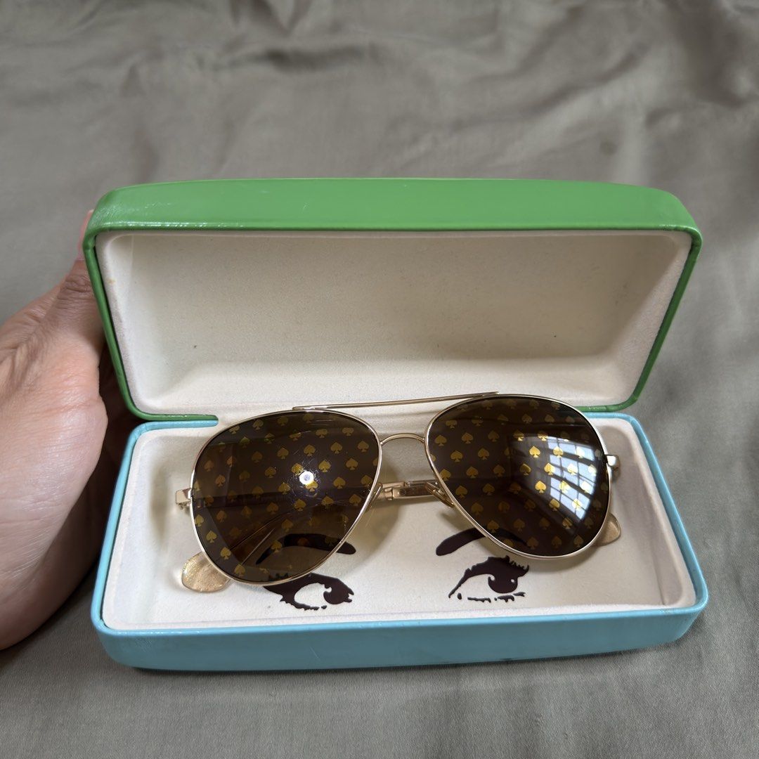 Authentic Kate Spade Aviator Sunglasses (Category: Sunglasses & Eyewear) located in Paranaque City. Submitted by _mrs.j (Listing ID 1429570050, Image 1). Description: Elevate your style with these Kate Spade Avaline2 94R aviator sunglasses in a stunning gold finish. These women’s sunglasses offer a classic pilot shape with a modern twist, perfect for adding a touch of luxury to any look. Featuring UV protective lenses, these Kate Spade sunglasses
