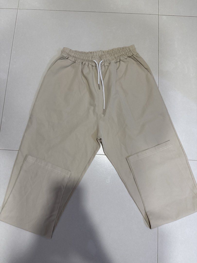 Beige Drawstring Pants (Category: Other Bottoms) located in Singapore. Submitted by angelyre_ (Listing ID 1429616005, Image 1). Description: These beige pants feature a drawstring waist and a relaxed fit. They have pockets on the sides. Perfect for casual wear. Can stretch to an M!.