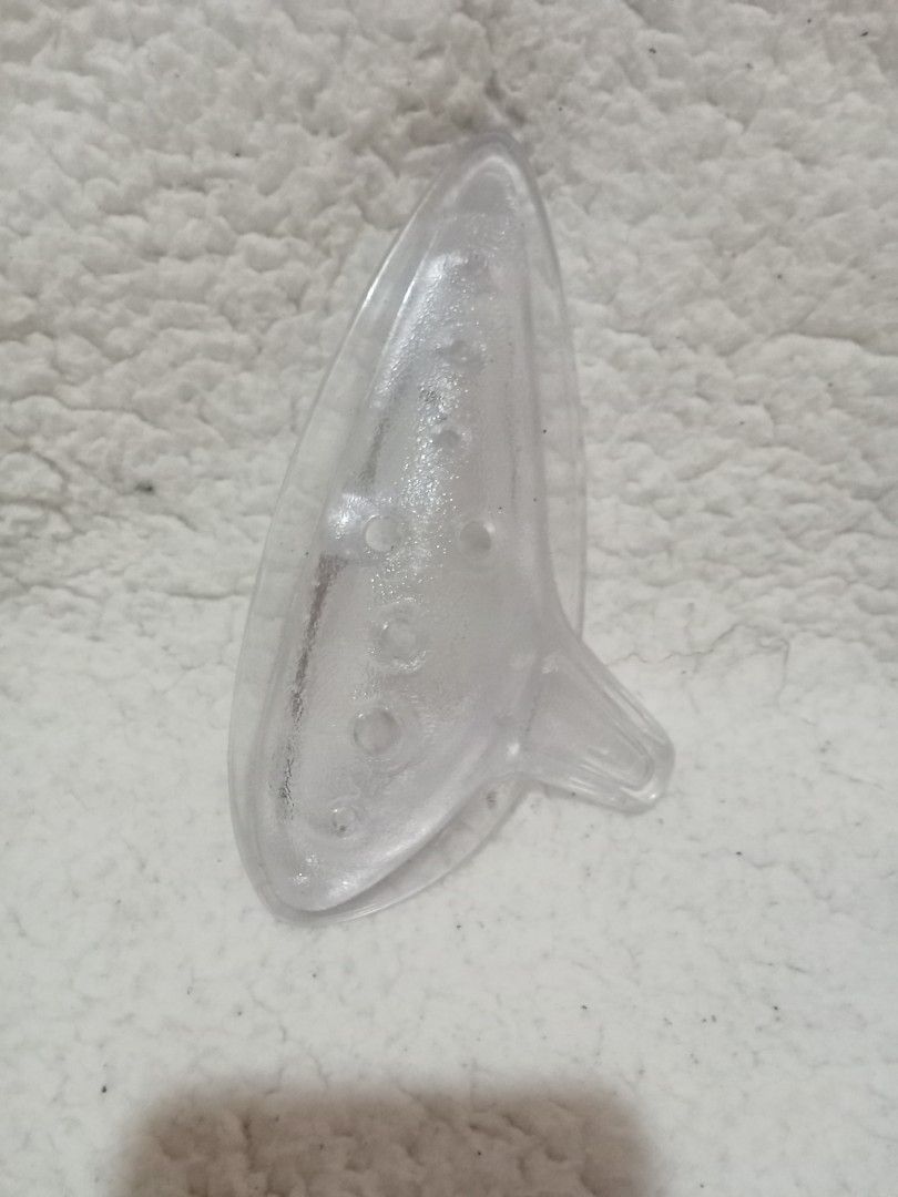 Clear Plastic Ocarina (Category: Musical Instruments) located in Bocaue. Submitted by marajapansurplus (Listing ID 1429554053, Image 1). Description: Japan sourced item.. Clear plastic ocarina. It has a teardrop shape with a mouthpiece and several holes. .