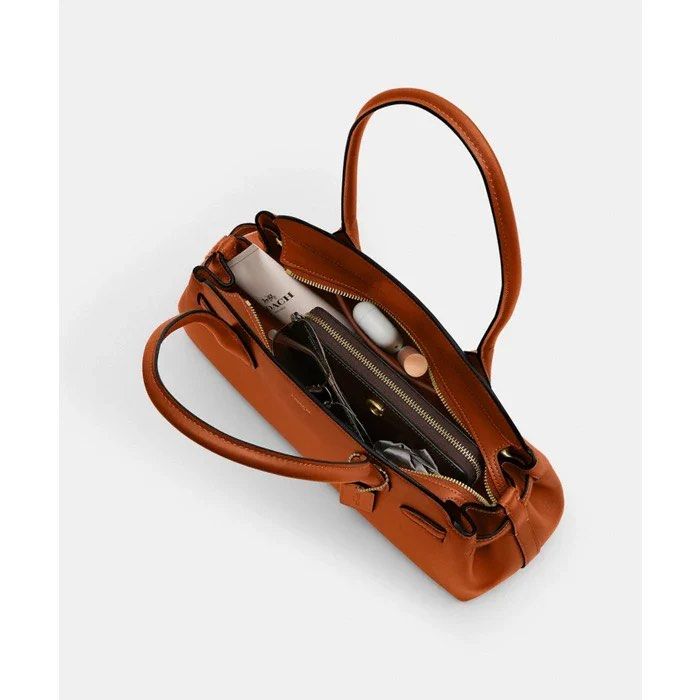 Coach Carryall Empire Shoulder Bag (Category: Luxury Bags & Wallets) located in Marikina City. Submitted by airamarie999 (Listing ID 1429654590, Image 2). Description: Follow us on facebook @maison.ai and enjoy exclusive discounts #empire #coachshoulderbag #authentic.