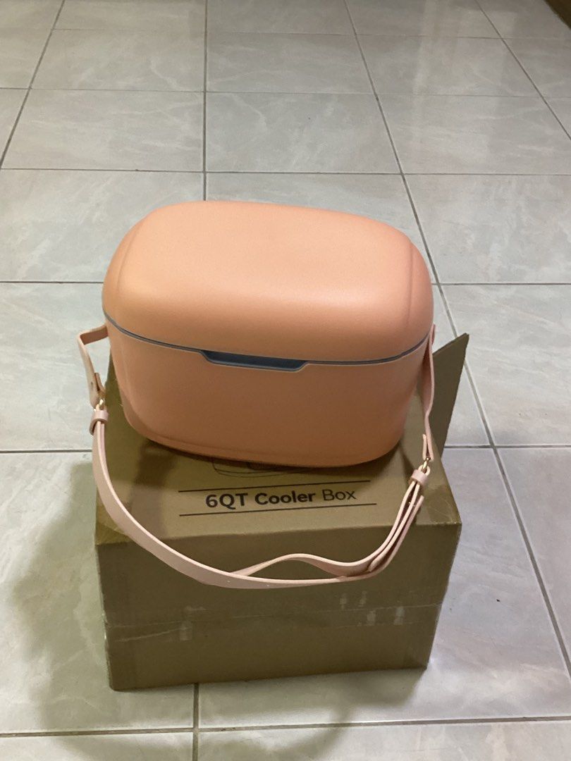 Cooler Box (Category: Food Organization & Storage) located in Pasay City. Submitted by kkalien (Listing ID 1429596063, Image 3). Description: Cooler Box It is a stylish accessory for your summer adventures. Features a durable design that keeps your food & drinks cool while being lightweight and easy to carry. Comfortable adjustable strap. Capacity: 12 litres Color: Pink Fabric Content: 100% POLYURETHANE Wash Care: Wipe with damp cloth The shippin