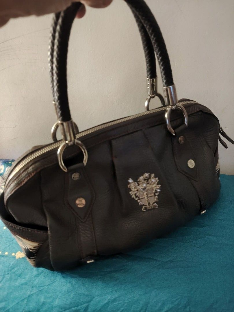 Dark Brown Leather Handbag with Braided Handles (Category: Luxury Bags & Wallets) located in Bulacan. Submitted by brandedbagspreloved (Listing ID 1429555823, Image 2). Description: medium size as is bawal sa maselan bili nalang s store ng daks my sign of use since preloved eto wlang butas hindi sira.