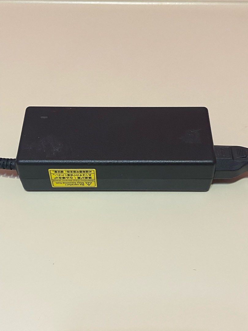 Dell laptop charger (Category: Laptops & Notebooks) located in Dasmarinas. Submitted by jawndice (Listing ID 1429576044, Image 3). Description: Dell 90W AC adapter, specifically model DA90PM111 with part number MK947. • Power Output: 19.5V, 4.62A, 90 Watts. • Input: 100-240V, 1.5A, 50-60Hz. • Compatibility: Designed for use with various Dell laptop models, including Inspiron, XPS, Latitude, and Vostro. • Manufacturer: Produced by Delta Electronic