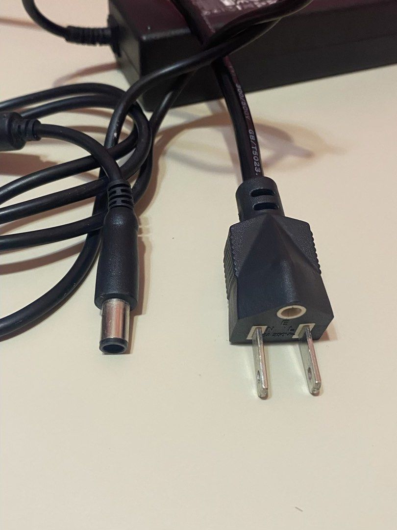 Dell laptop charger (Category: Laptops & Notebooks) located in Dasmarinas. Submitted by jawndice (Listing ID 1429576044, Image 2). Description: Dell 90W AC adapter, specifically model DA90PM111 with part number MK947. • Power Output: 19.5V, 4.62A, 90 Watts. • Input: 100-240V, 1.5A, 50-60Hz. • Compatibility: Designed for use with various Dell laptop models, including Inspiron, XPS, Latitude, and Vostro. • Manufacturer: Produced by Delta Electronic
