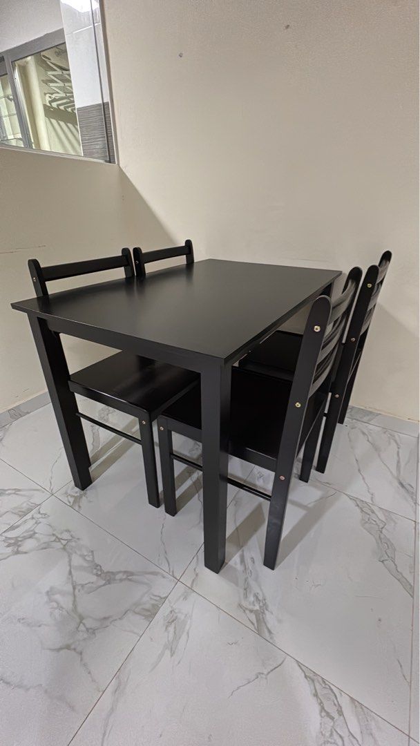 Dining Table Set (Category: Tables & Sets) located in Singapore. Submitted by brendagan63413 (Listing ID 1429635005, Image 1). Description: Dining table - L110cm x W70cm x H74cm 4 chairs Black wooden .