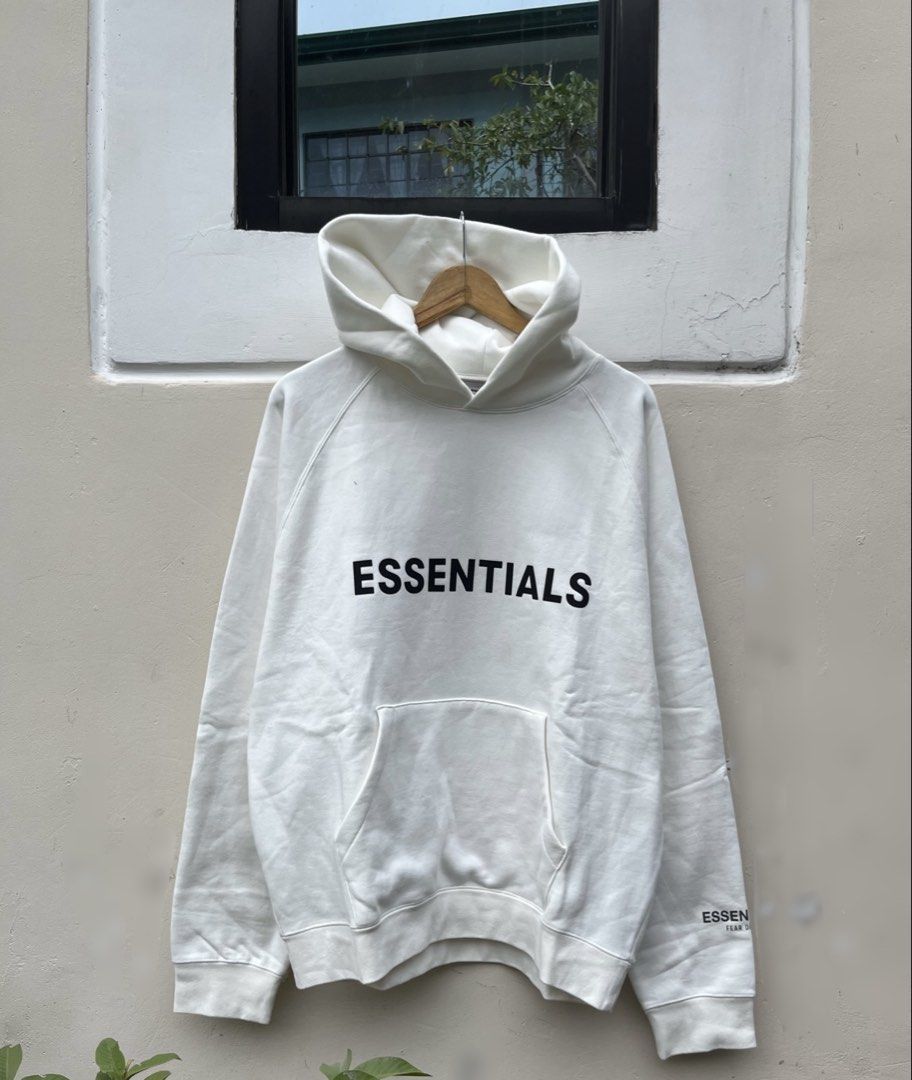 ESSENTIALS FEAR OF GOD HOODIE (Category: Hoodies) located in Baguio. Submitted by closetgc.clothingshop (Listing ID 1429542140, Image 1). Description: - ESSENTIALS FEAR OF GOD Hoodie - Color: White - Size: M on tag ( OVER SIZE FITS L-XL ) - Features the "ESSENTIALS" logo on the front and sleeve.