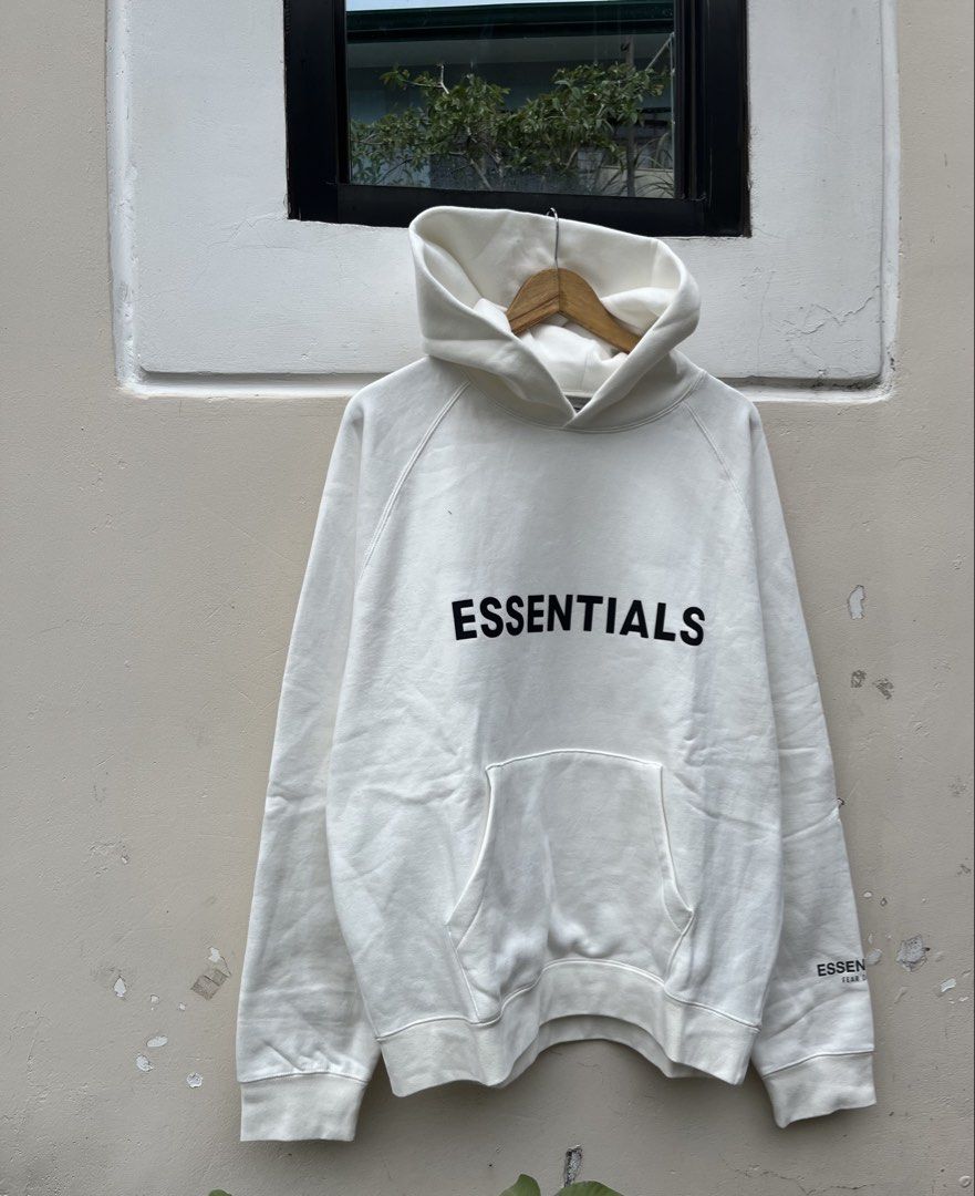 ESSENTIALS FEAR OF GOD HOODIE (Category: Hoodies) located in Baguio. Submitted by closetgc.clothingshop (Listing ID 1429542140, Image 3). Description: - ESSENTIALS FEAR OF GOD Hoodie - Color: White - Size: M on tag ( OVER SIZE FITS L-XL ) - Features the "ESSENTIALS" logo on the front and sleeve.