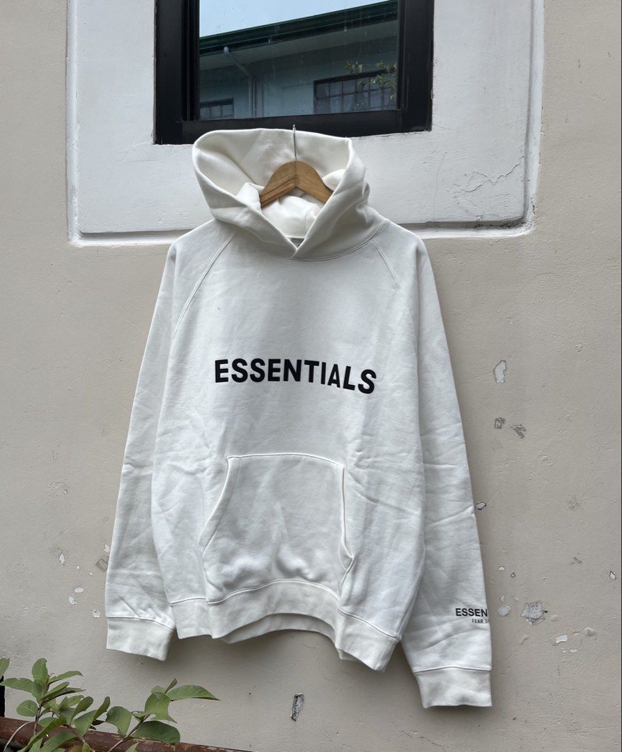 ESSENTIALS FEAR OF GOD HOODIE (Category: Hoodies) located in Baguio. Submitted by closetgc.clothingshop (Listing ID 1429542140, Image 2). Description: - ESSENTIALS FEAR OF GOD Hoodie - Color: White - Size: M on tag ( OVER SIZE FITS L-XL ) - Features the "ESSENTIALS" logo on the front and sleeve.