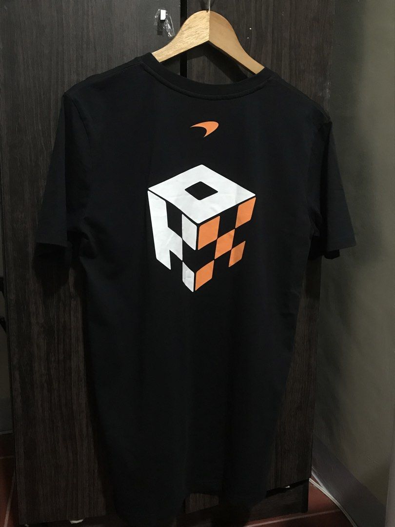 (F1) McLaren Formula 1 Team Shirt (Category: Tshirts & Polo Shirts ) located in Bulacan. Submitted by dailybumps (Listing ID 1429523274, Image 3). Description: - 20.5x29 - Authentic - Black color - can fit M-L sizing - Features McLaren and OKX logos on the front - Unique cube design on the back - Perfect for F1 fans.