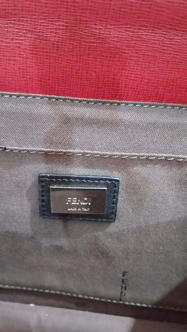 Fendi Monster Demi Jour Shoulder Bag Authentic (Category: Luxury Bags & Wallets) located in Tacloban City. Submitted by luxbag_ph (Listing ID 1429546238, Image 2). Description: Fendi Demi Jour shoulder bag with a unique monster eye design. Features a top handle and a detachable shoulder strap. The bag has a burgundy body with a cream and pink top panel. The interior has a leather lining and a magnetic closure. Includes Fendi branding on the hardw