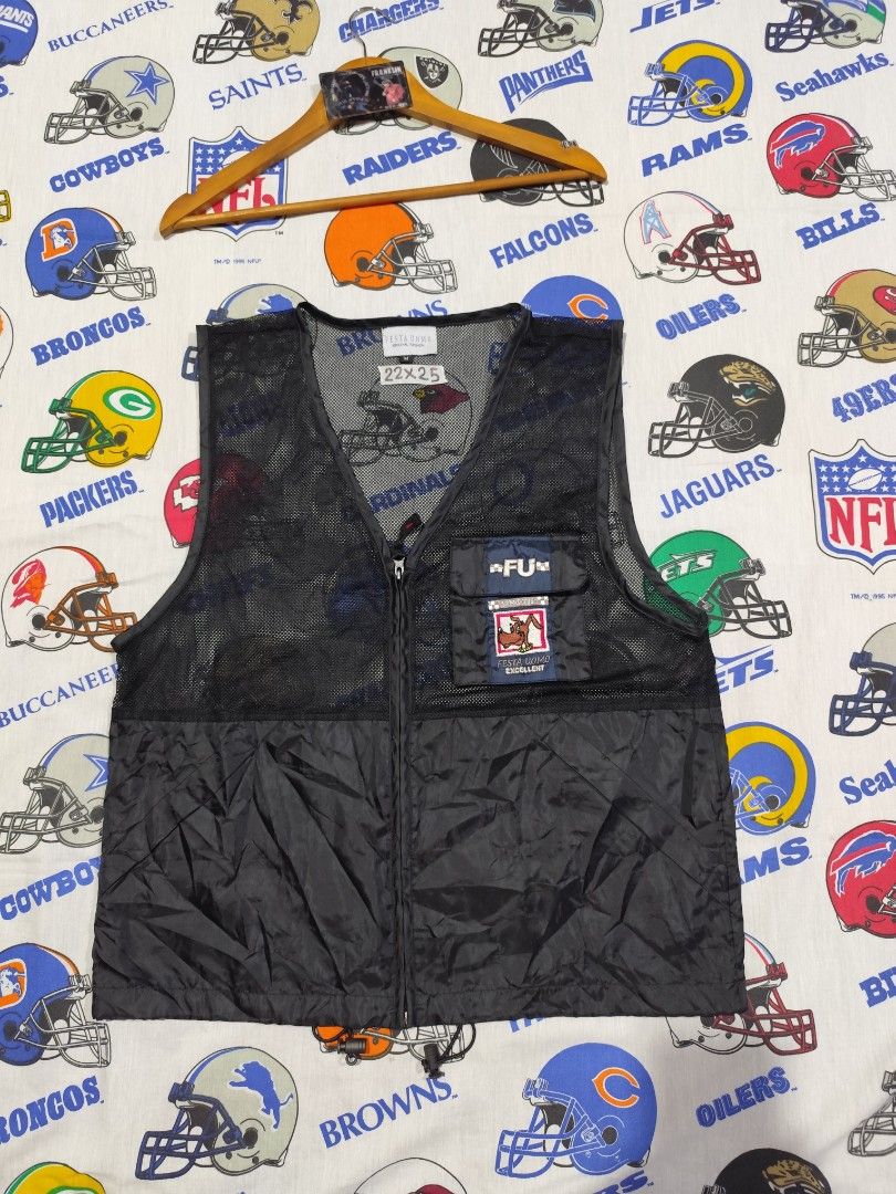Festa Uomo Black Vest (Category: Vests) located in Baguio. Submitted by FRANKLIN (Listing ID 1429660146, Image 1). Description: Black vest from Festa Uomo. Features a zip closure and a pocket with a logo patch. The vest has a mesh upper section and a solid lower section. The size tag indicates a size M and the measurements are 22x25. The vest has a "FU" logo on the pocket..