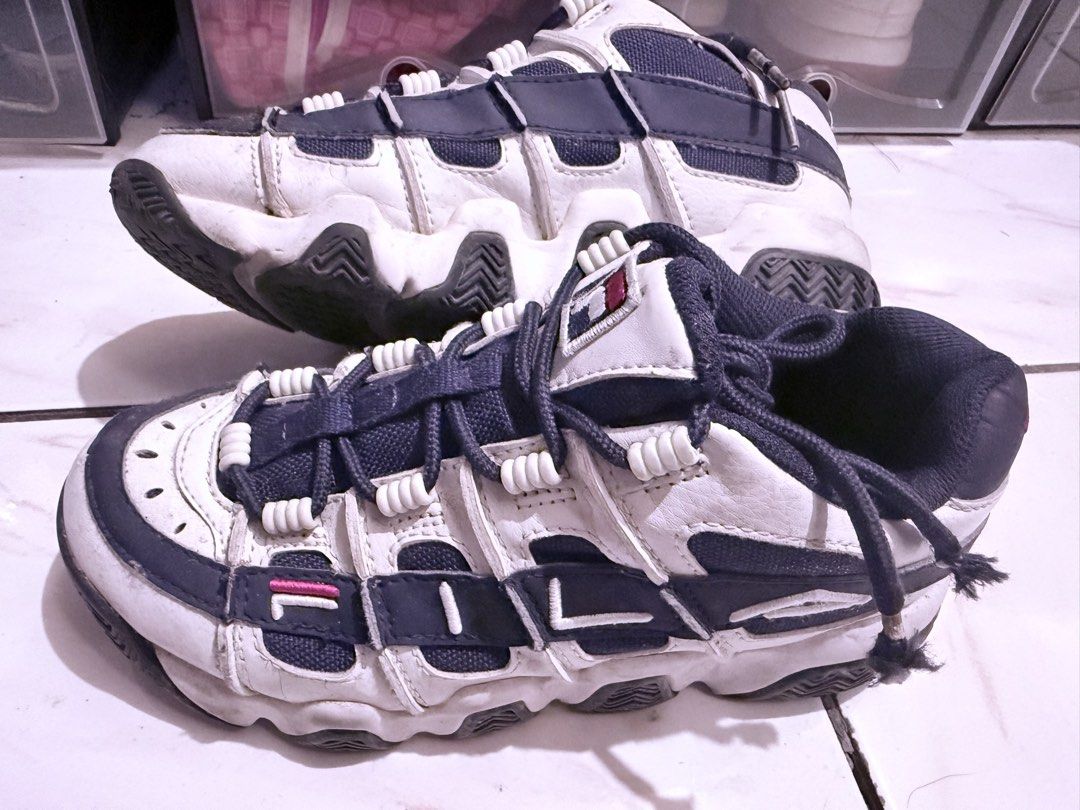 FILA Barricade XT97 (Category: Sneakers) located in Manila. Submitted by matchmagebox (Listing ID 1429562567, Image 1). Description: Fila Barricade XT 97 Low. Color palette is white and navy blue. The main body is white leather, with navy blue accents on the lacing system, side panels, and sole..