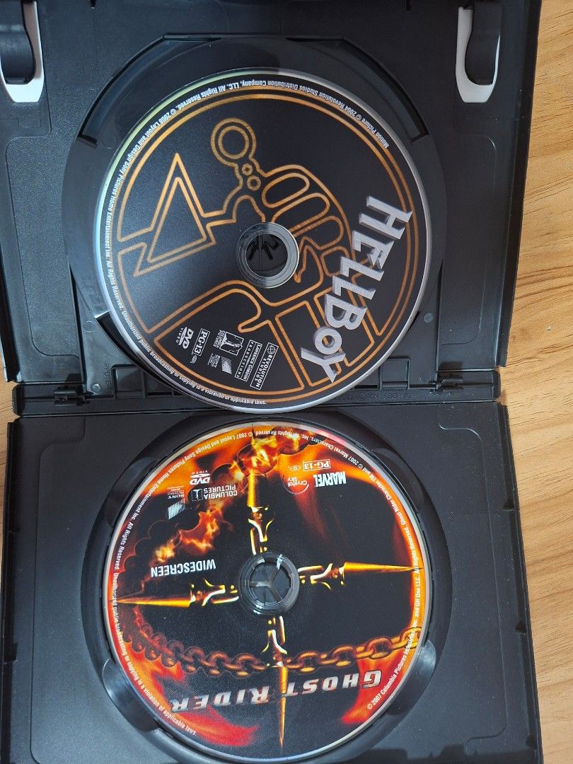 Ghost Rider & Hellboy Double Feature DVD (Category: CDs & DVDs) located in Kabankalan. Submitted by Videoshop.ph (Listing ID 1429621530, Image 3). Description: Double feature DVD featuring Ghost Rider and Hellboy. Includes both movies on two discs. The case shows the movie titles and actors. The back of the case has a plot summary for each movie. A Marvel and Columbia Pictures production..