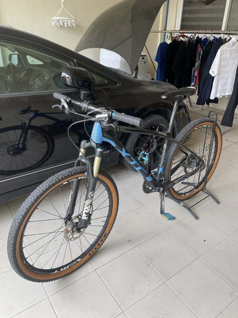 Giant XTC SLR Mountain Bike (Category: Bicycles) located in Marilao. Submitted by love.gisellemarie (Listing ID 1429592982, Image 3). Description: Giant XTC SLR mountain bike features Shimano SLX components and a Fox suspension fork. It has Maxxis tires and a black and blue frame. The bike is equipped with disc brakes and a Shimano XT rear derailleur..