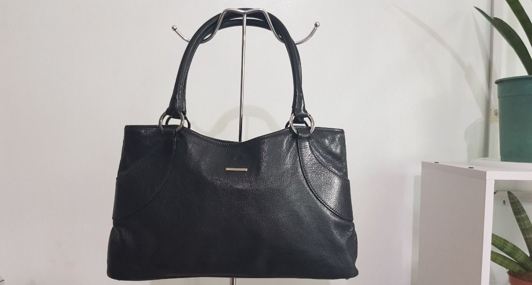 Gucci Black Leather Tote Bag (Category: Luxury Bags & Wallets) located in Los Banos. Submitted by mommybabyshopper (Listing ID 1429522166, Image 1). Description: • Authentic Gucci tote bag in black cowhide leather. • With entrupy certificate of authenticity. • Bag only, no box/paper bag/dustbag • Very nice silver hardware.