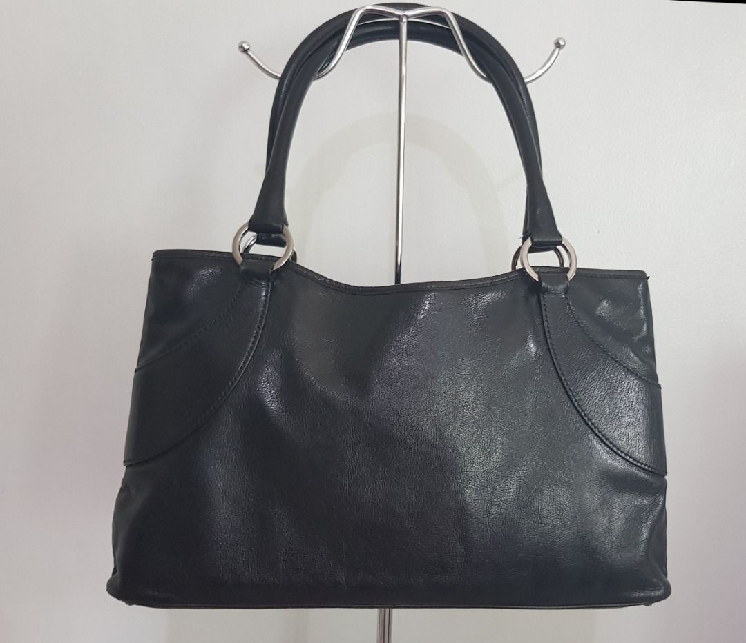 Gucci Black Leather Tote Bag (Category: Luxury Bags & Wallets) located in Los Banos. Submitted by mommybabyshopper (Listing ID 1429522166, Image 3). Description: • Authentic Gucci tote bag in black cowhide leather. • With entrupy certificate of authenticity. • Bag only, no box/paper bag/dustbag • Very nice silver hardware.