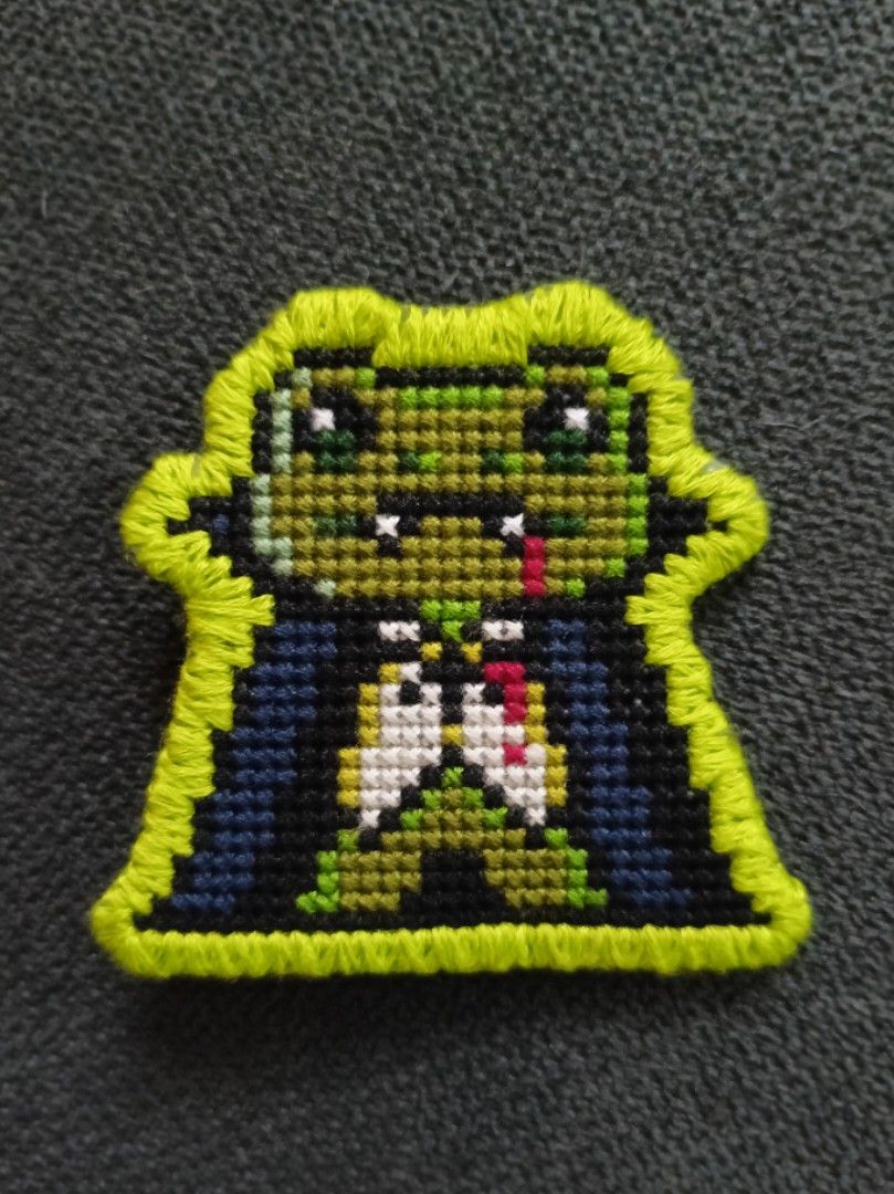 Handmade Cross Stitch Vampire Frog Pin (Category: Handmade Craft) located in Pasig City. Submitted by sleepyfairy (Listing ID 1429650334, Image 1). Description: Handmade cross-stitch pin Vampire frog design Because this item is 100% handmade, slight variations in stitching may occur, making your pin unique! perfect for unique gifts for cross-stitch lovers message me if you have questions about the item thank you 🩷.