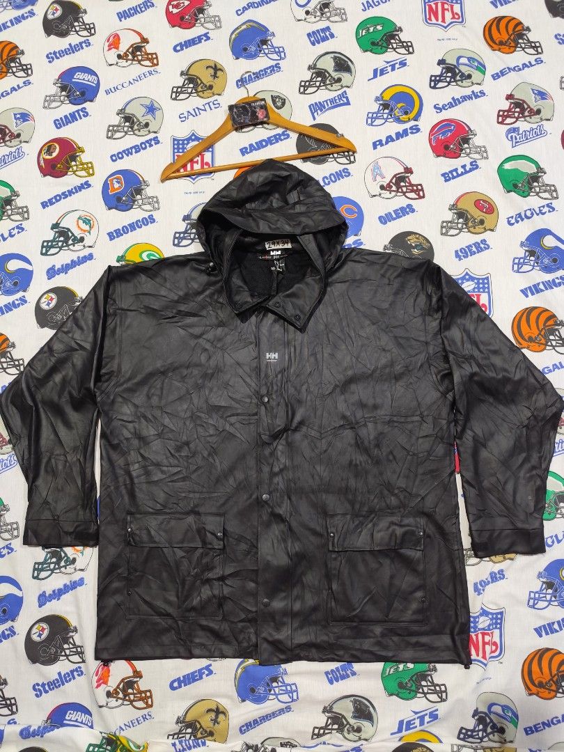 Helly Hansen Black Rain Jacket XXL (Category: Coats, Jackets and Outerwear) located in Baguio. Submitted by FRANKLIN (Listing ID 1429660129, Image 1). Description: Black Helly Hansen rain jacket. Features a hood, button closure, and two front pockets. The jacket is a men's XXL size. Made in China. Outer material is 100% PU, and the back is 100% polyester. The jacket has the HH work wear logo on the front and buttons. The jacket is designed for wo