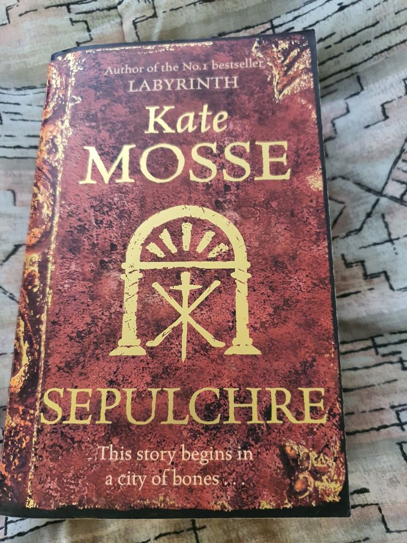 Kate Mosse Sepulchre (Category: Storybooks) located in Quezon City. Submitted by cuiquesuum (Listing ID 1429552849, Image 1). Description: Light, foxing spots and a tanned oxidation to the pages. The binding is secure. There is a 2-line writing on the first page by the previous owner. Cover is intact but shows clear, noticeable wear, such as scuffs, minor creases, or edge wear. It is in perfectly readable condition. .