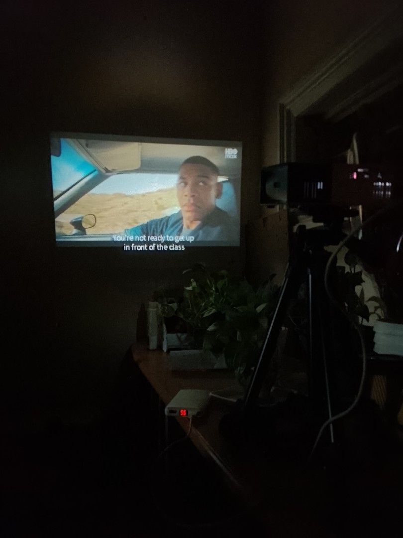 LED Portable Projector with Tripod (Category: Projectors) located in San Fernando. Submitted by matt_sells619 (Listing ID 1429606189, Image 3). Description: Compact projector with a tripod for easy setup. It projects clear images, as seen in the photos, showing various movies and scenes. Perfect for home entertainment or small gatherings. Includes the projector and tripod. RFS: Projector no longer in use..