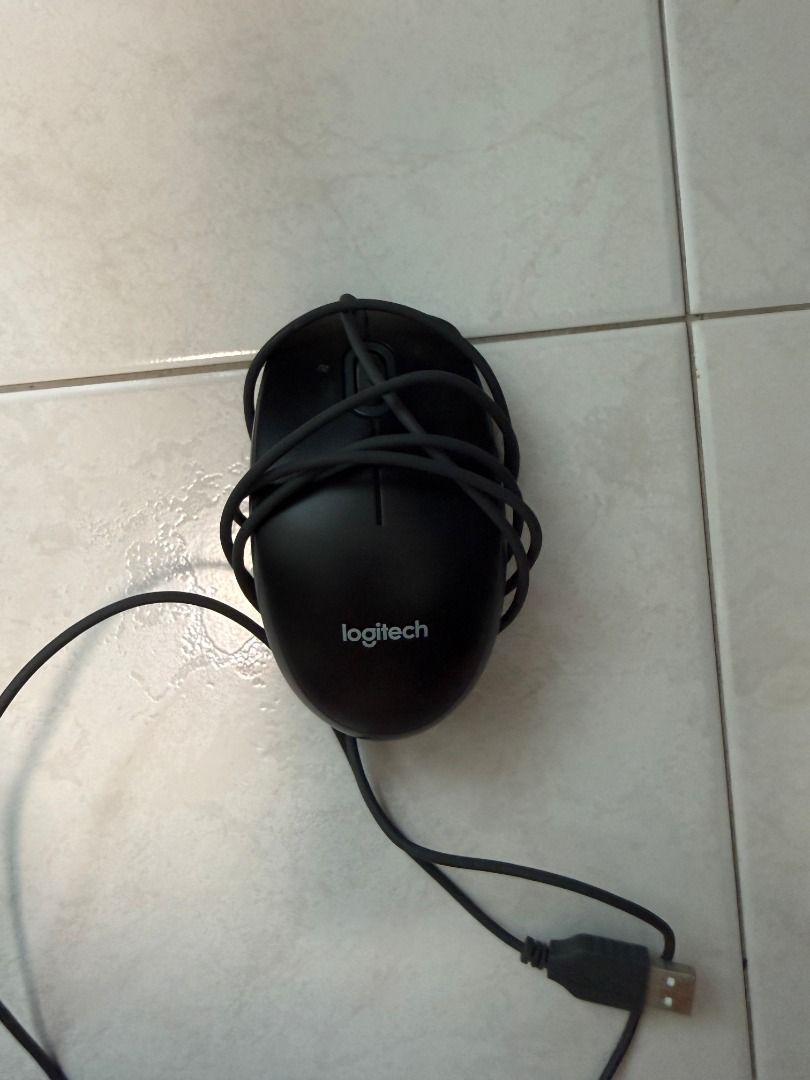 Logitech Wired Mouse (Category: Mouse & Mousepads) located in Singapore. Submitted by justforl (Listing ID 1429565798, Image 1). Description: Black Logitech wired mouse. In good working condition. Features a standard USB connection. Perfect for everyday use..