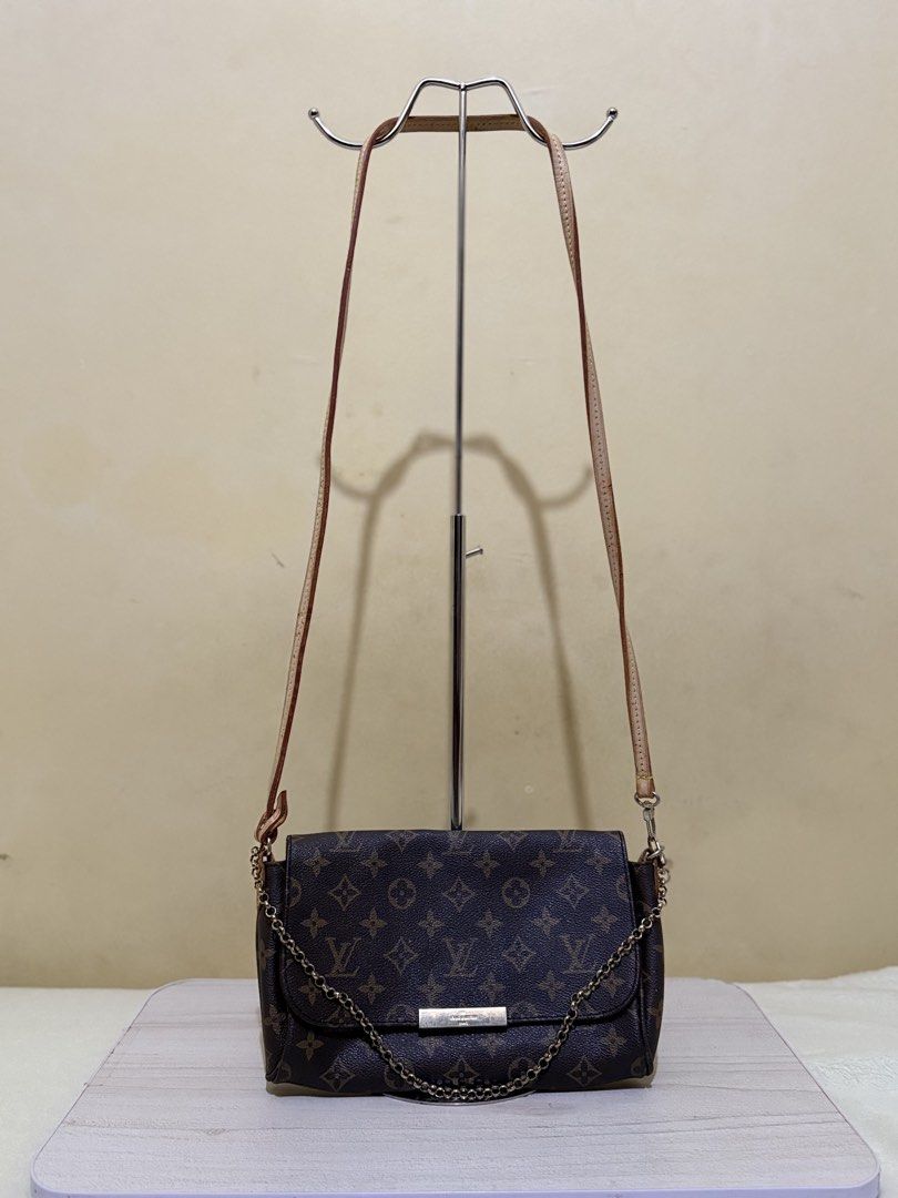 Louis Vuitton Favorite (Category: Luxury Bags & Wallets) located in Cagayan de Oro. Submitted by twice.but.nice.blackmarket (Listing ID 1429539544, Image 1). Description: Design: Crafted from durable Monogram coated canvas with natural cowhide leather (vachetta) trim. Hardware: Features a signature gold-tone metal plate with the Louis Vuitton engraving and a magnetic flap closure. Straps: Traditionally includes both a removable short gold-tone ch