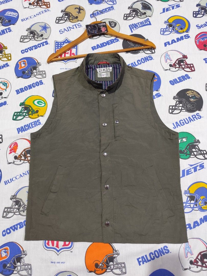 Macbeth Jeans Company Vest - Size L (Category: Vests) located in Baguio. Submitted by FRANKLIN (Listing ID 1429660142, Image 2). Description: Macbeth Jeans Company vest in olive green. Features a button-up front, a small chest pocket, and a striped lining. The vest has a classic collar and a quilted back. Size L. Made with polyester and cotton. The vest has a tag with washing instructions..