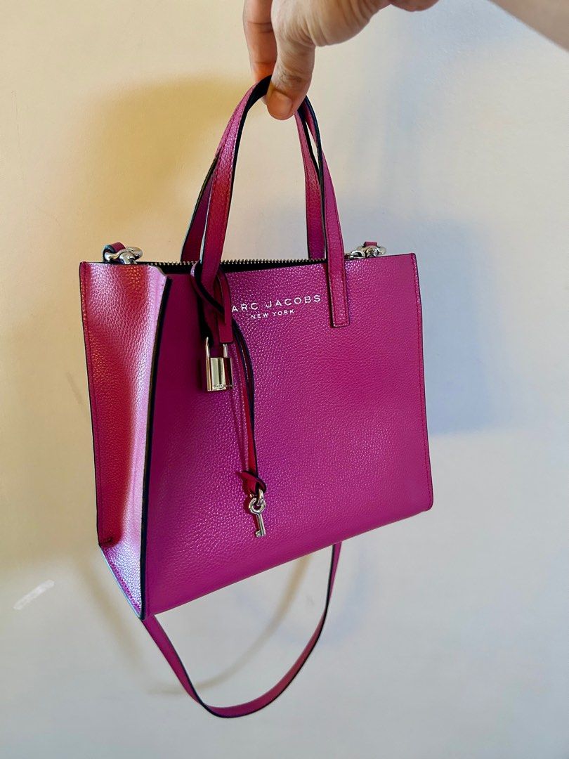 Marc Jacobs Mini Grind Tote Bag pink preloved (Category: Tote Bags) located in Taguig. Submitted by ramsthrift (Listing ID 1429561153, Image 1). Description: Preloved Marc Jacobs Mini Grind pink Tote bag * guaranteed authentic * good condition 9/10 * comes with replacement dustbag.