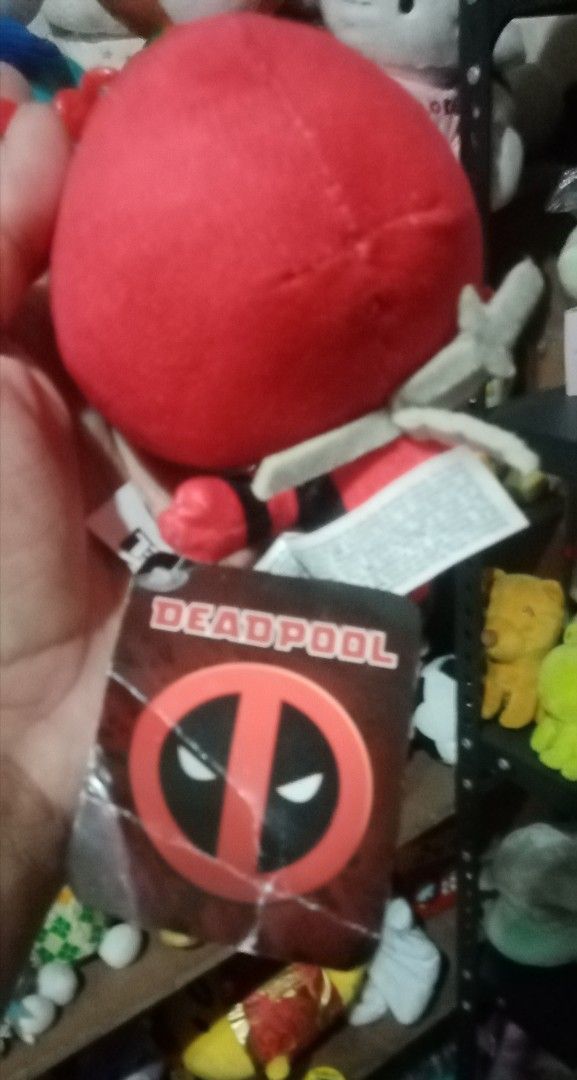 Marvel Deadpool Plushie Keychain (Category: Plushies & Soft Toys) located in Bulacan. Submitted by renasophiatoystore2020 (Listing ID 1429620424, Image 2). Description: Adorable Deadpool plushie is perfect for any Marvel fan! It features a keychain attachment, making it easy to bring Deadpool with you wherever you go. The plushie has a vibrant red and black color scheme, with the iconic Deadpool logo on the tag. It's a great collectible item or a