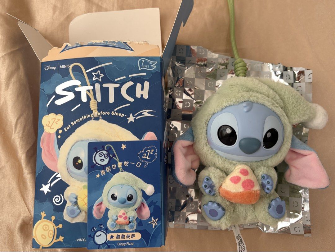 Miniso Disney Stitch Plush Toy (Category: Plushies & Soft Toys) located in Bulacan. Submitted by Padmeph (Listing ID 1429566329, Image 1). Description: - Miniso Disney Stitch plush toy - From the 'Eat Something Before Sleep' series - Features Stitch in sleepwear holding pizza - Blind box: 7 designs to collect - Vinyl plush toy - Perfect for Disney fans and collectors.