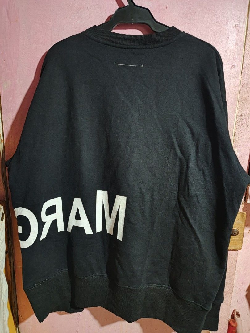 MM6 Maison Margiela Black Sweatshirt (Category: Longsleeves) located in Abuyog. Submitted by cotton09 (Listing ID 1429615962, Image 2). Description: Black sweatshirt from MM6 Maison Margiela. Features a large white logo on the front and back. Made in Italy. Size S. The care label is included in the images. The sweatshirt has a crew neck and long sleeves..