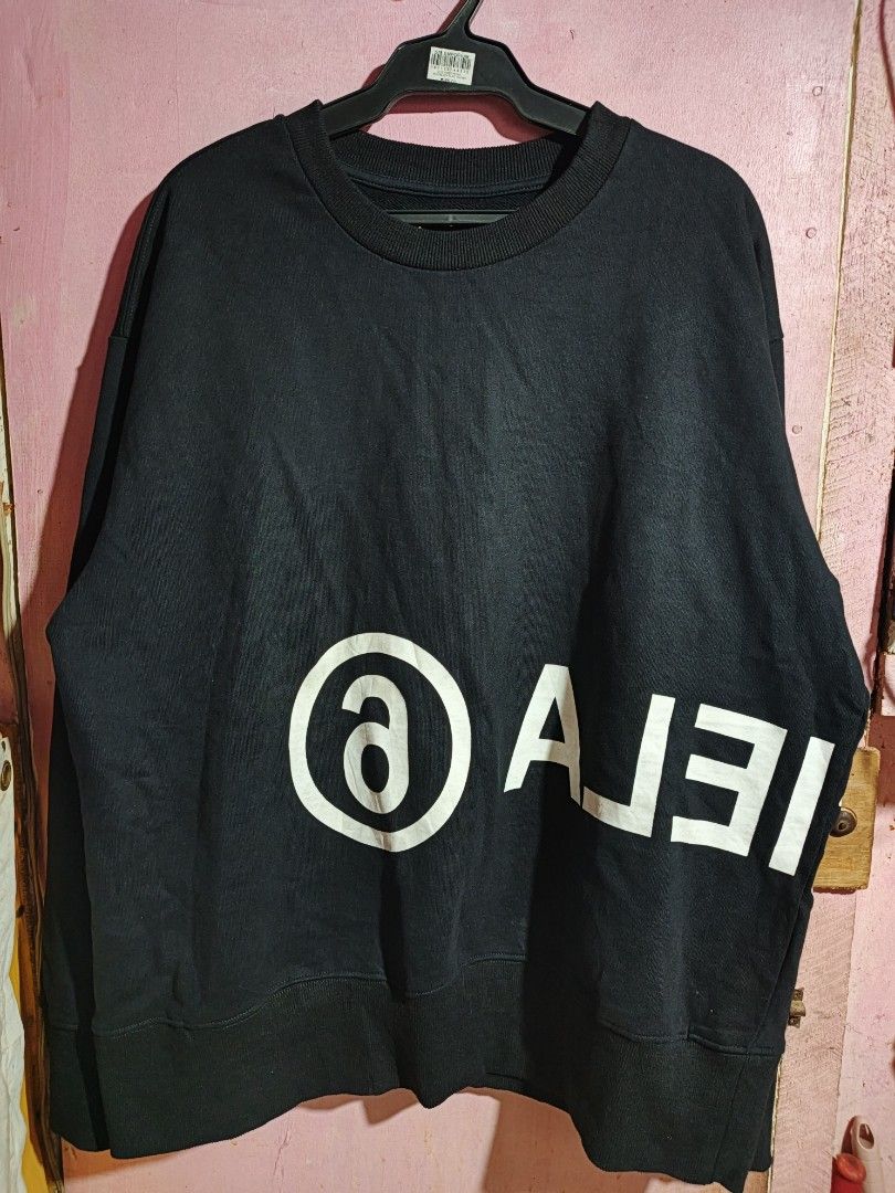 MM6 Maison Margiela Black Sweatshirt (Category: Longsleeves) located in Abuyog. Submitted by cotton09 (Listing ID 1429615962, Image 1). Description: Black sweatshirt from MM6 Maison Margiela. Features a large white logo on the front and back. Made in Italy. Size S. The care label is included in the images. The sweatshirt has a crew neck and long sleeves..